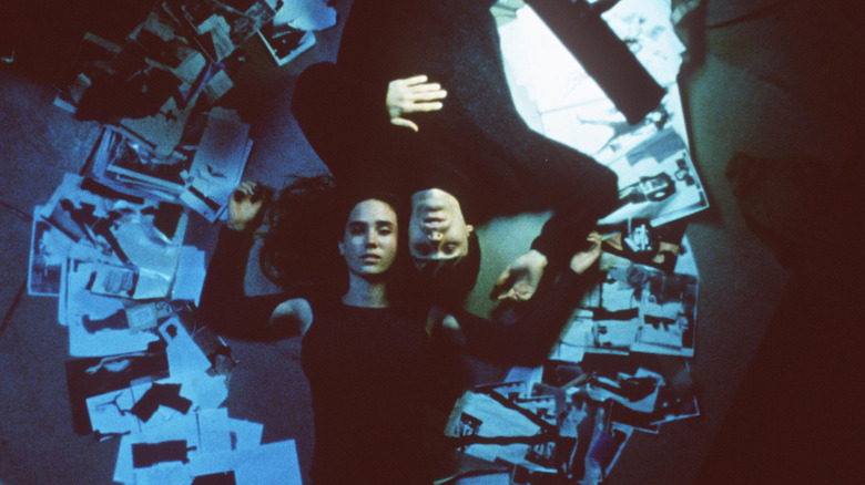 Man and woman lie on floor in Requiem for a Dream
