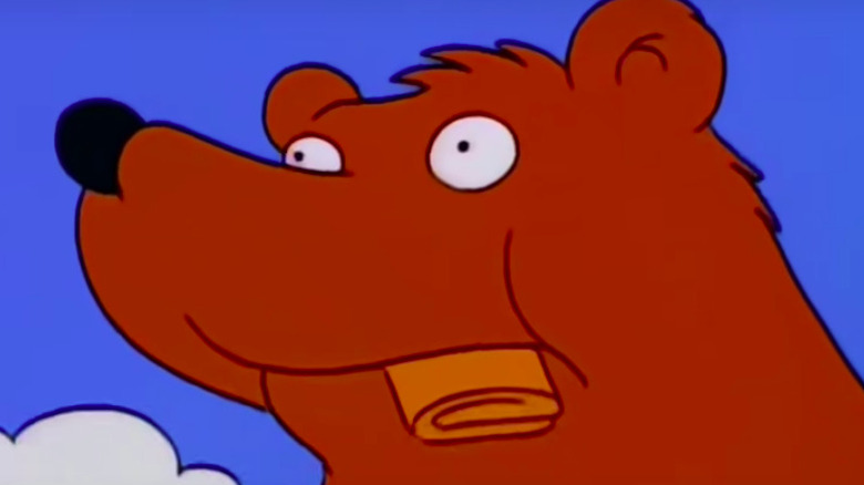 Bear chewing on wallet