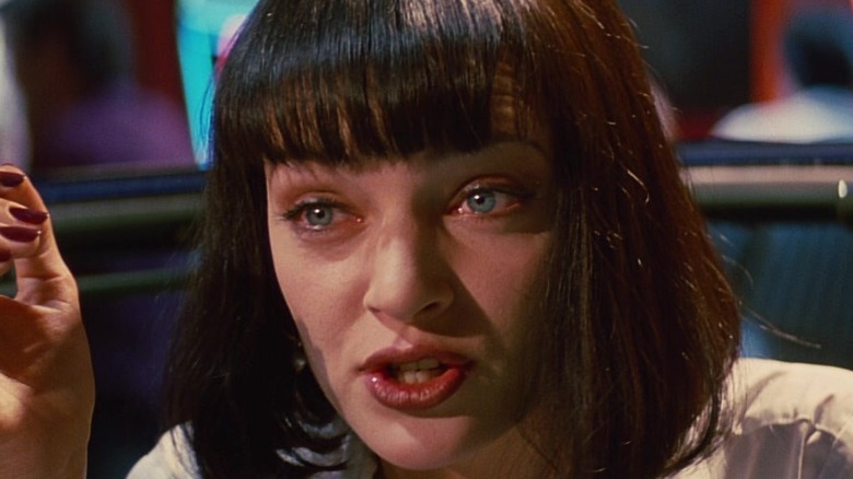 Mia Wallace holding a cigarette