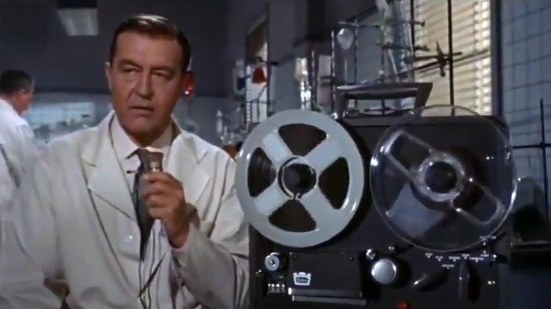 Scientist recording his work