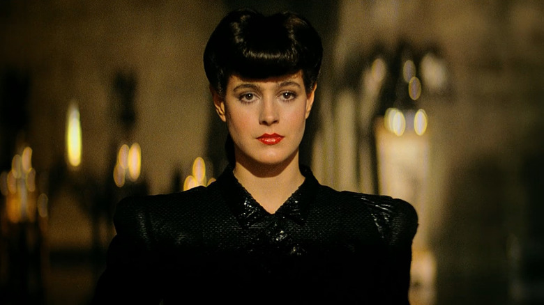 The replicant Rachael enters the room in "Blade Runner" (1982)