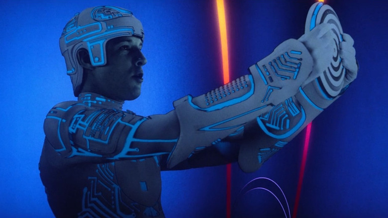Tron holding up an identity disk in "Tron" (1982)