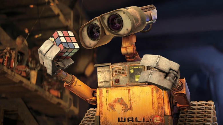 Wall-E holds a Rubik's Cube