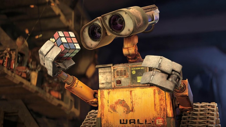 Wall-E holds a Rubik's Cube