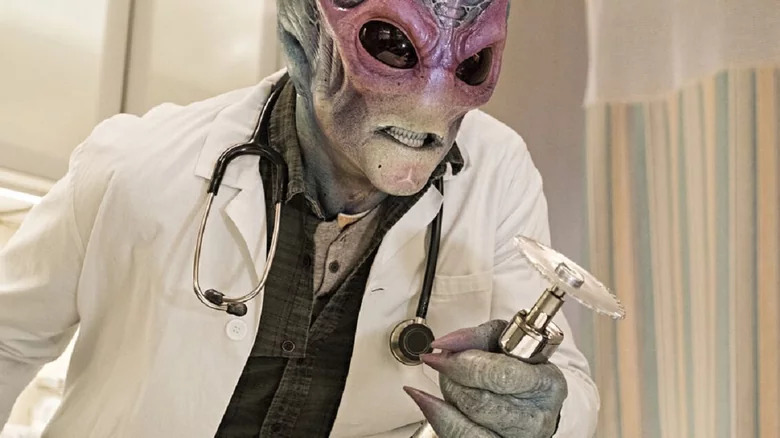 Alien doctor holds bone saw