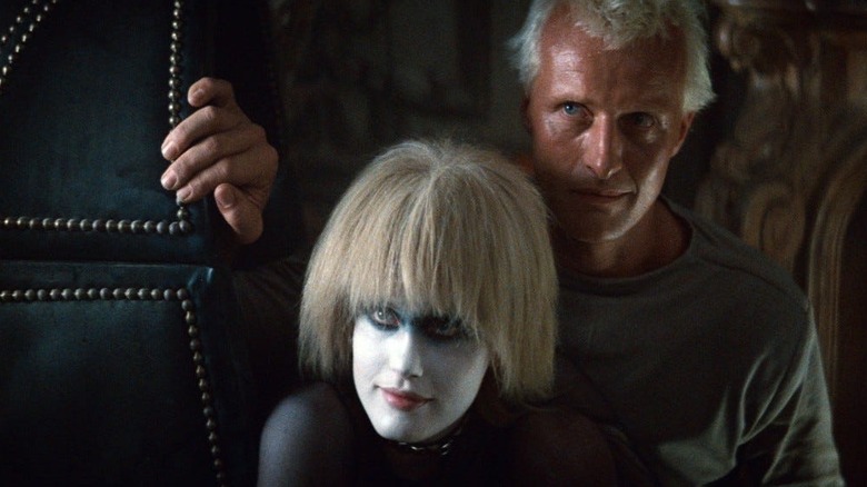 Batty and Pris stand in a doorway in "Blade Runner" (1982)