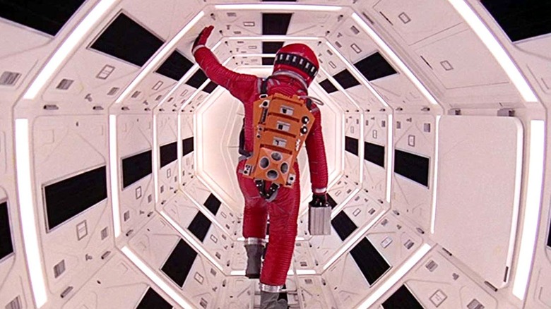 Dr. David Bowman walking down a white space corridor in Discovery One in "2001: A Space Odyssey"