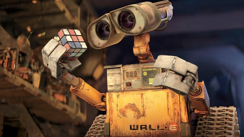 WALL-E looking at a Rubik's Cube in "WALL-E"