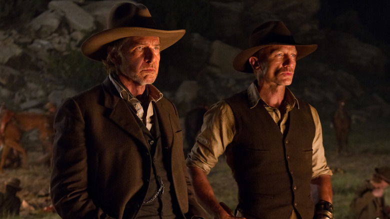 Woodrow and Jake standing outside at night in "Cowboys & Aliens"