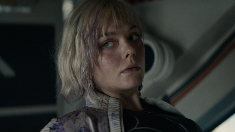 Thia with purple splotched on her in "Predator: Badlands"