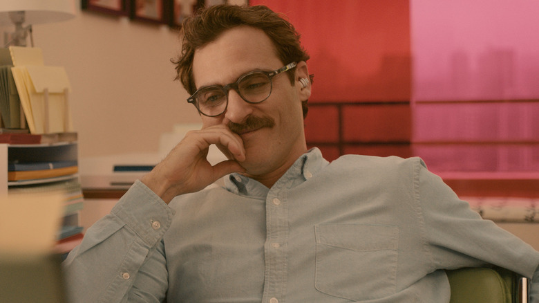 Theodore listening to Samantha in his earpiece in Her