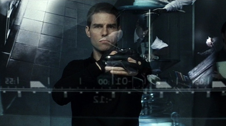 John Anderton in Minority Report, scrolling through a timeline on a transparent screen