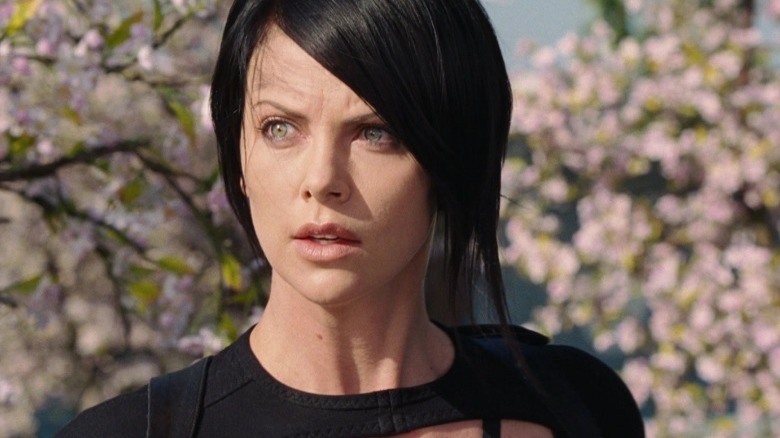 Aeon Flux in front of blossoming trees