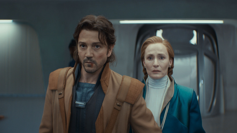 Cassian Andor leading Mon Mothma out of the Imperial Senate building in Andor Season 2 (2025)