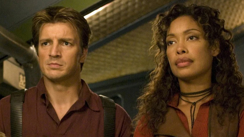 Zoe Washburne and Malcolm Reynold frowning in Firefly (2002)