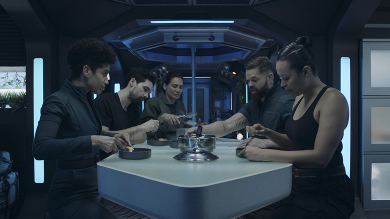 The crew of the Rocinante eating a meal together in The Expanse Season 6 (2021)