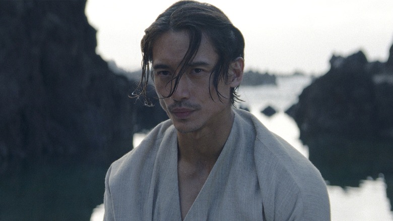 The Stranger pursing his lips in Acolyte