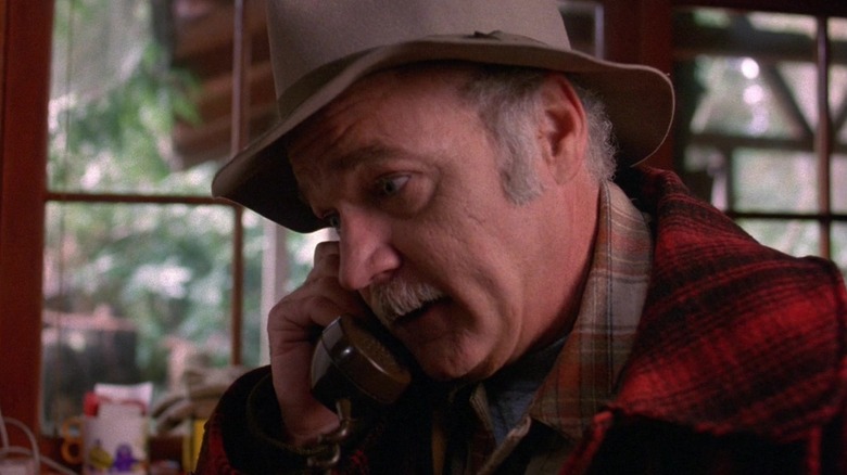 Jack Nance from "Twin Peaks" (1990) holding a phone and looking shocked