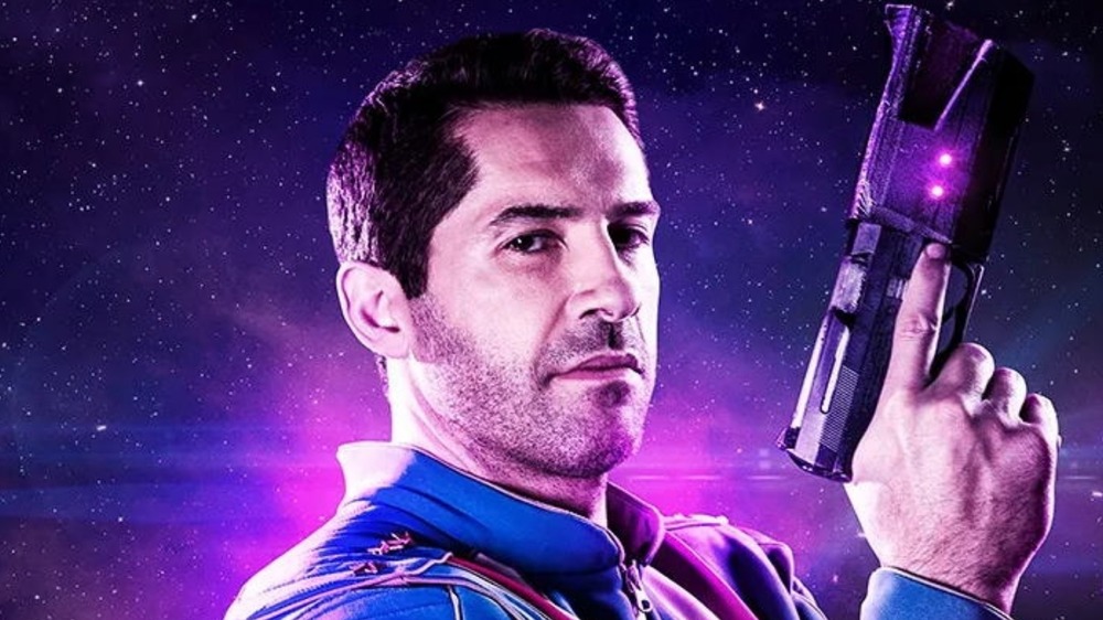 Max Cloud Scott Adkins poses with a space gun 