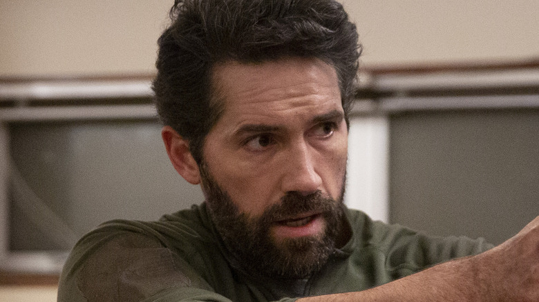 Scott Adkins facing away as Jake Harris in One Shot