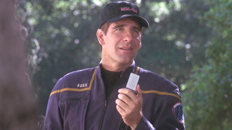 Captain Jonathan Archer holding communicator 