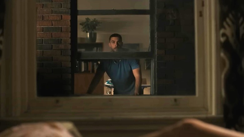 Danny Brackett scared in window