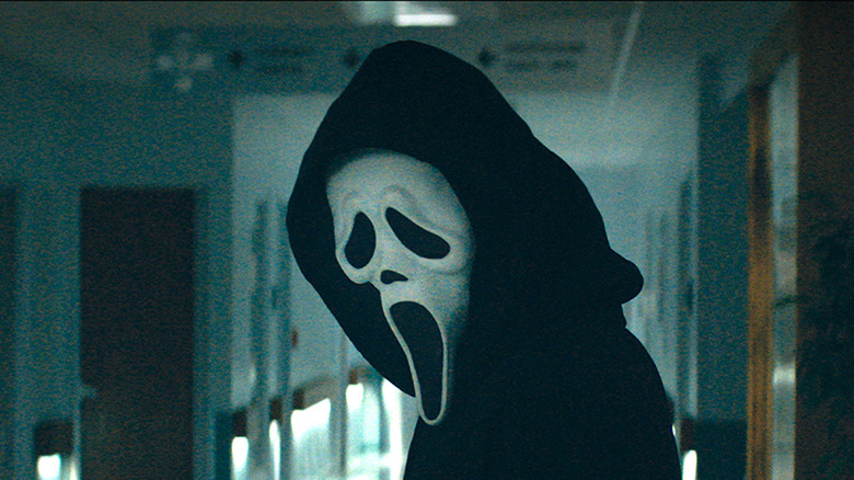 Ghostface standing in hallway