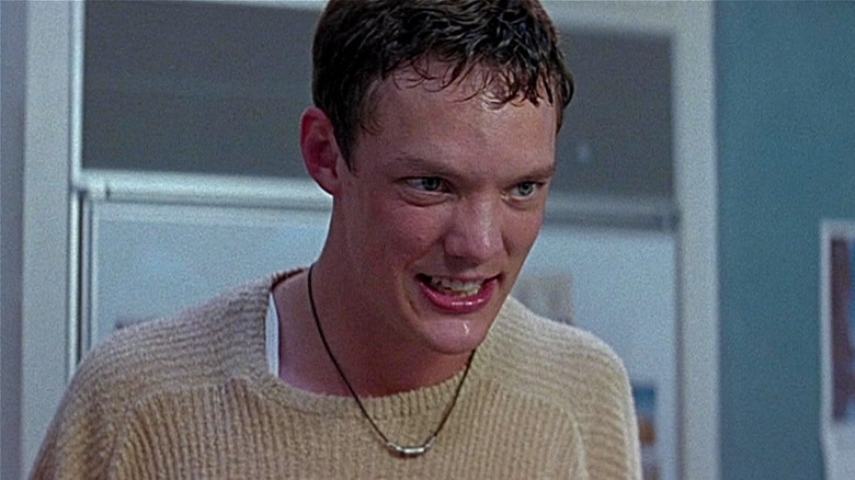 Stu Macher leering in the kitchen