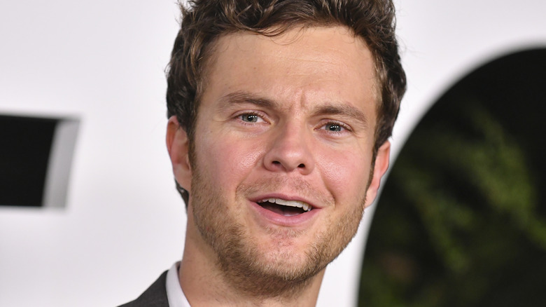 Jack Quaid posing