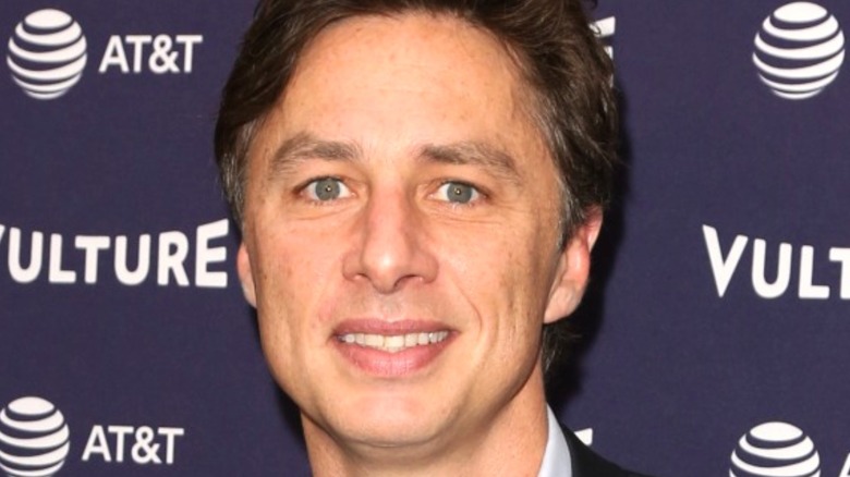 Zach Braff smiles at a premier 