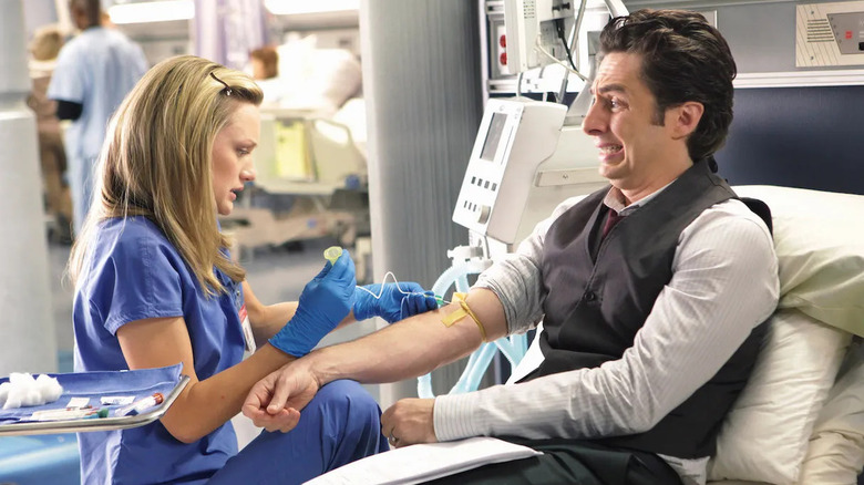 Med student Lucy practicing inserting a needle on J.D. in Season 9 of Scrubs