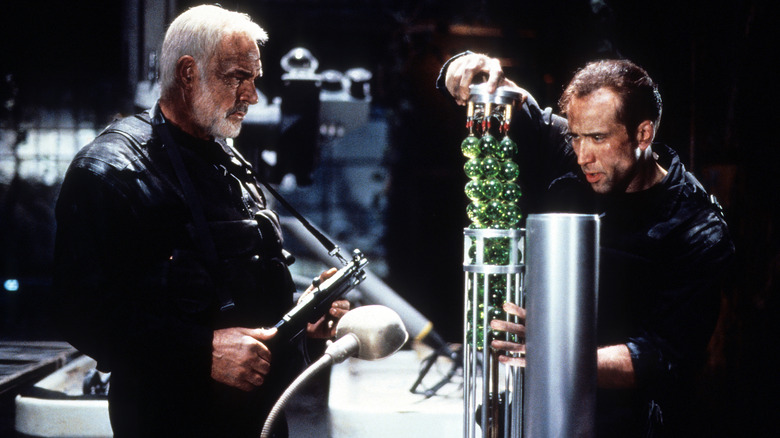 Mason watches as Goodspeed disarms a bomb in The Rock (1996)
