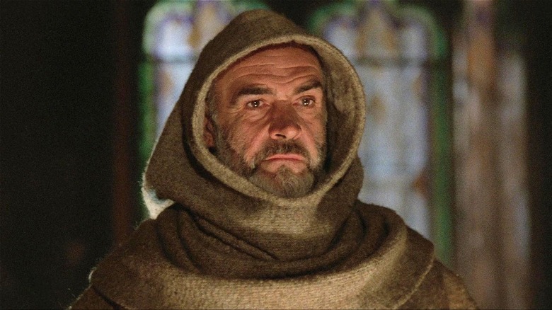 William of Baskerville staring out of a thick robe in The Name of the Rose