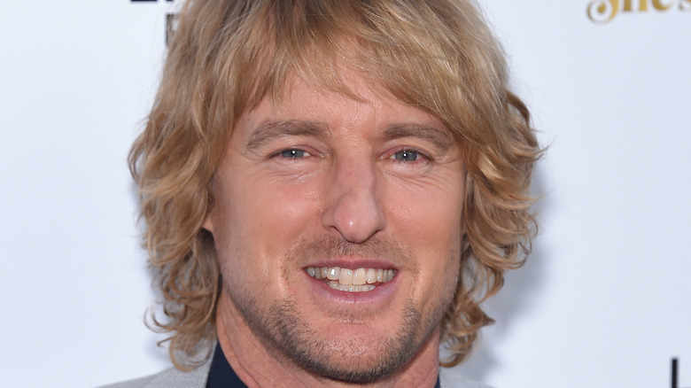 Owen Wilson smiling at a premiere