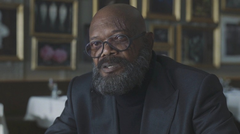 Nick Fury seated in restaurant