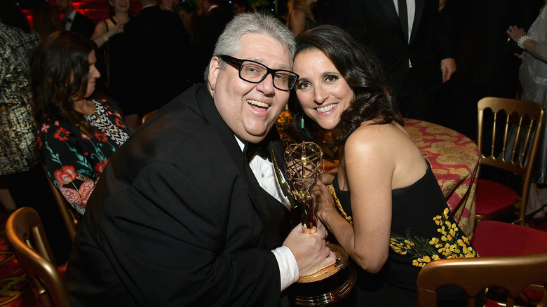 Julia Louis-Dreyfus and David Mandel holding Emmy