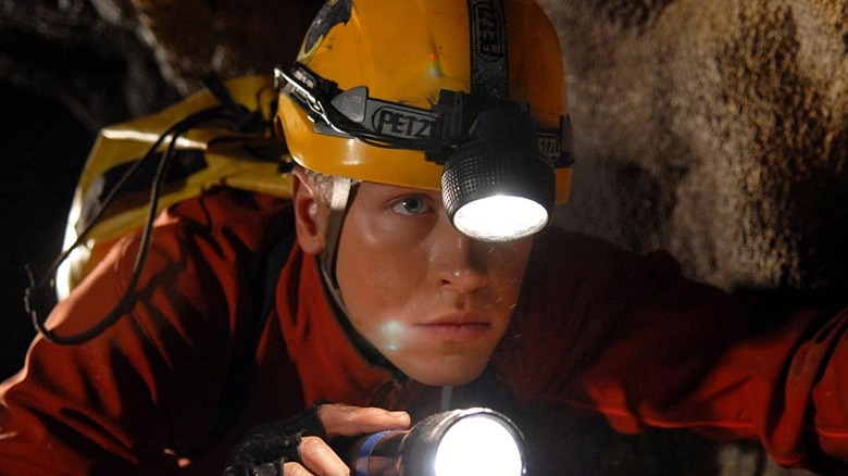 Spelunker with flashlight