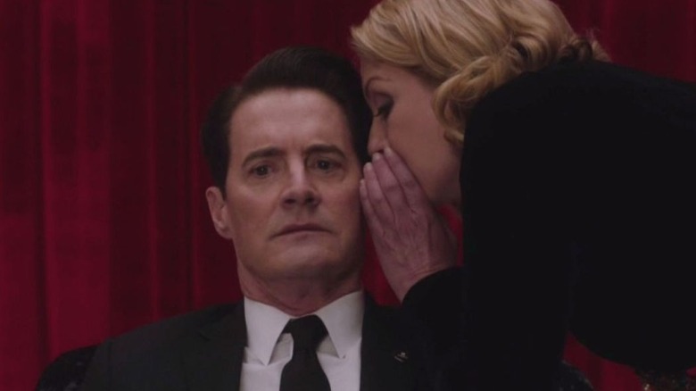 Laura whispers to Cooper