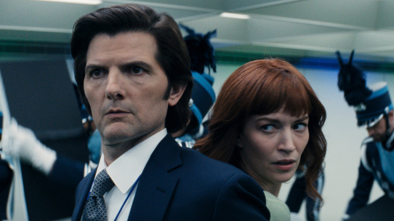 Mark and Helly looking at marching band on Severance (2025)