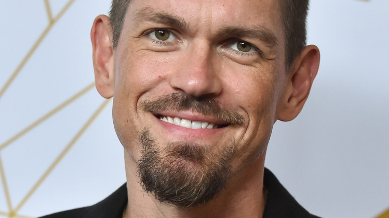 Steve Howey smiles