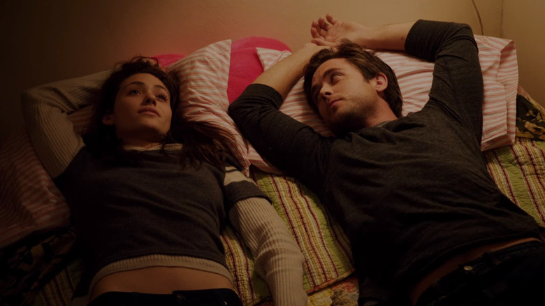 Fiona and Jimmy laying side by side in bed