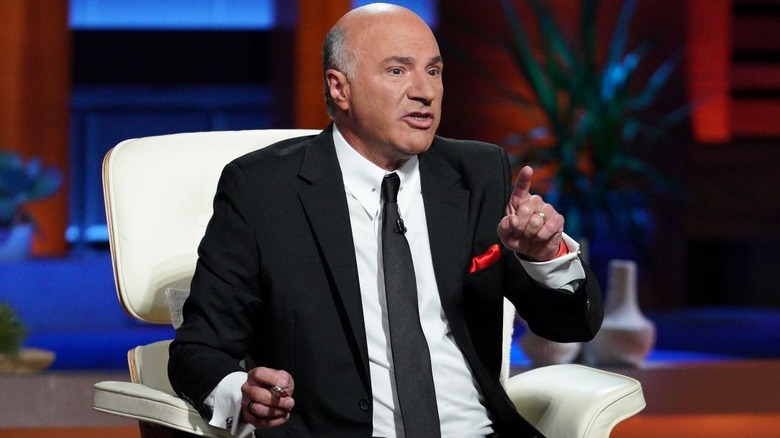 Kevin O'Leary sitting on the "Shark Tank" set