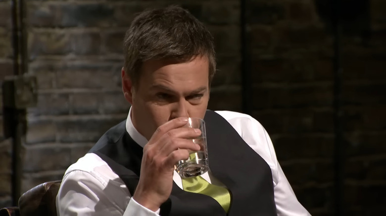 Peter Jones taking a sip of water on Dragons' Den