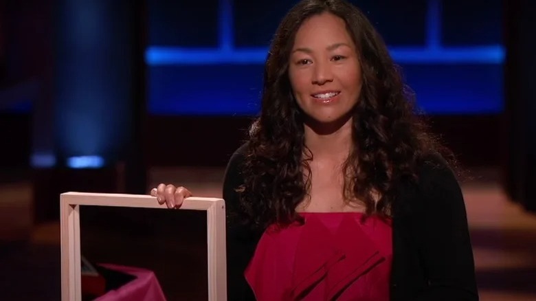 Belinda Jasmine holding her Skinny Mirror on Shark Tank Season 7