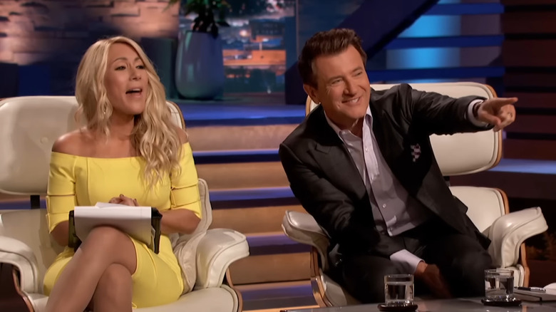 Lori Greiner laughing and Robert Herjavec pointing on Shark Tank Season 10