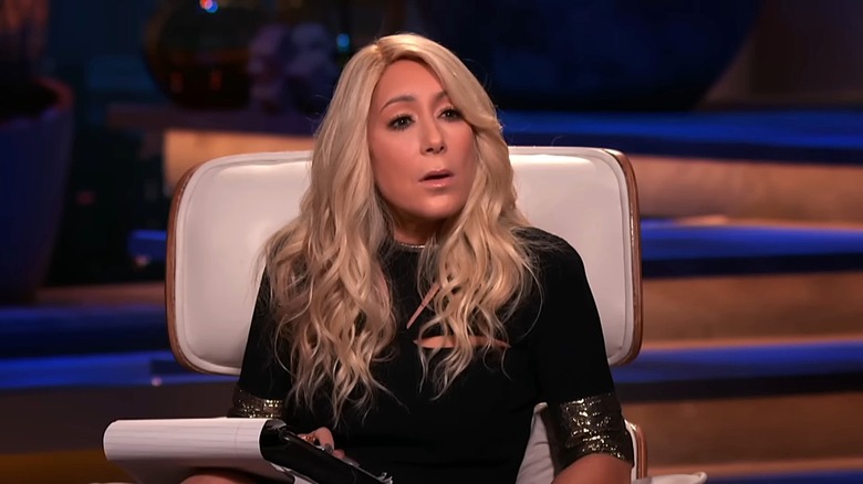 Lori Greiner wearing black and sitting on a chair in Shark Tank Season 12
