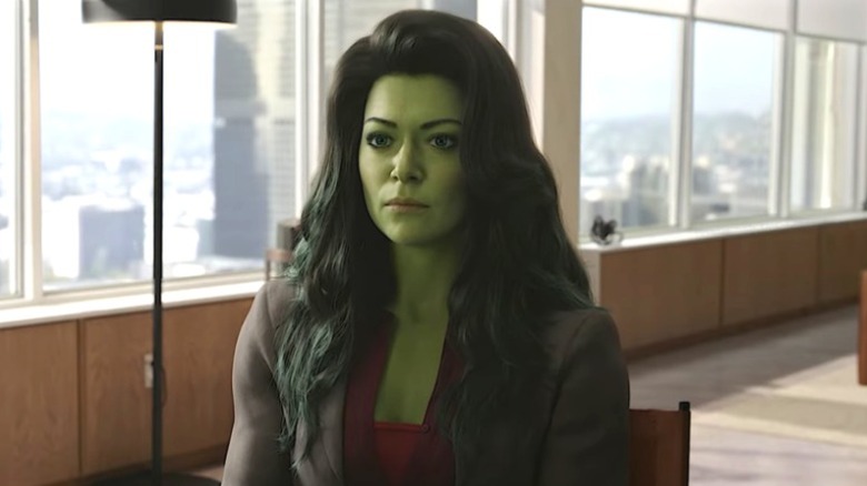 She-Hulk seated in a high-rise office building