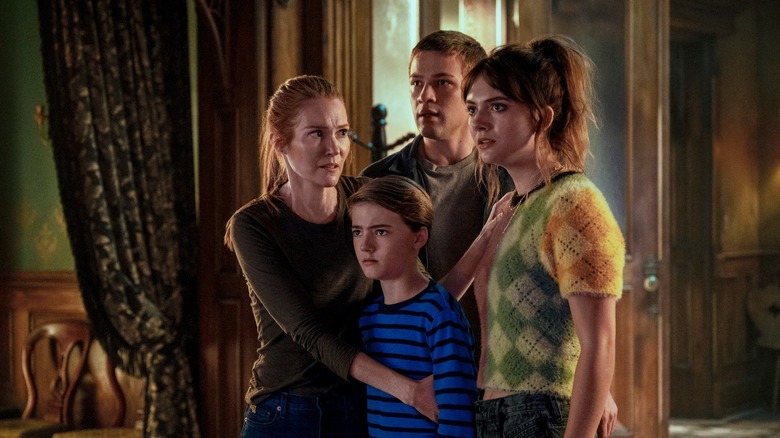 The Locke family huddled together