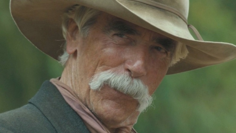 Sam Elliott looks left