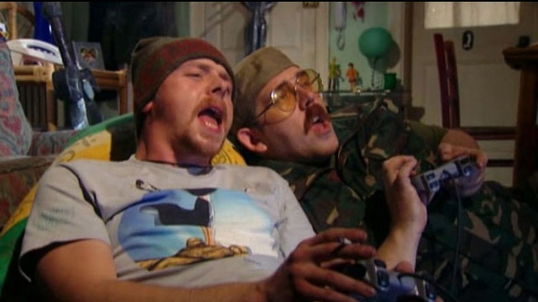 Spaced mates playing Playstation